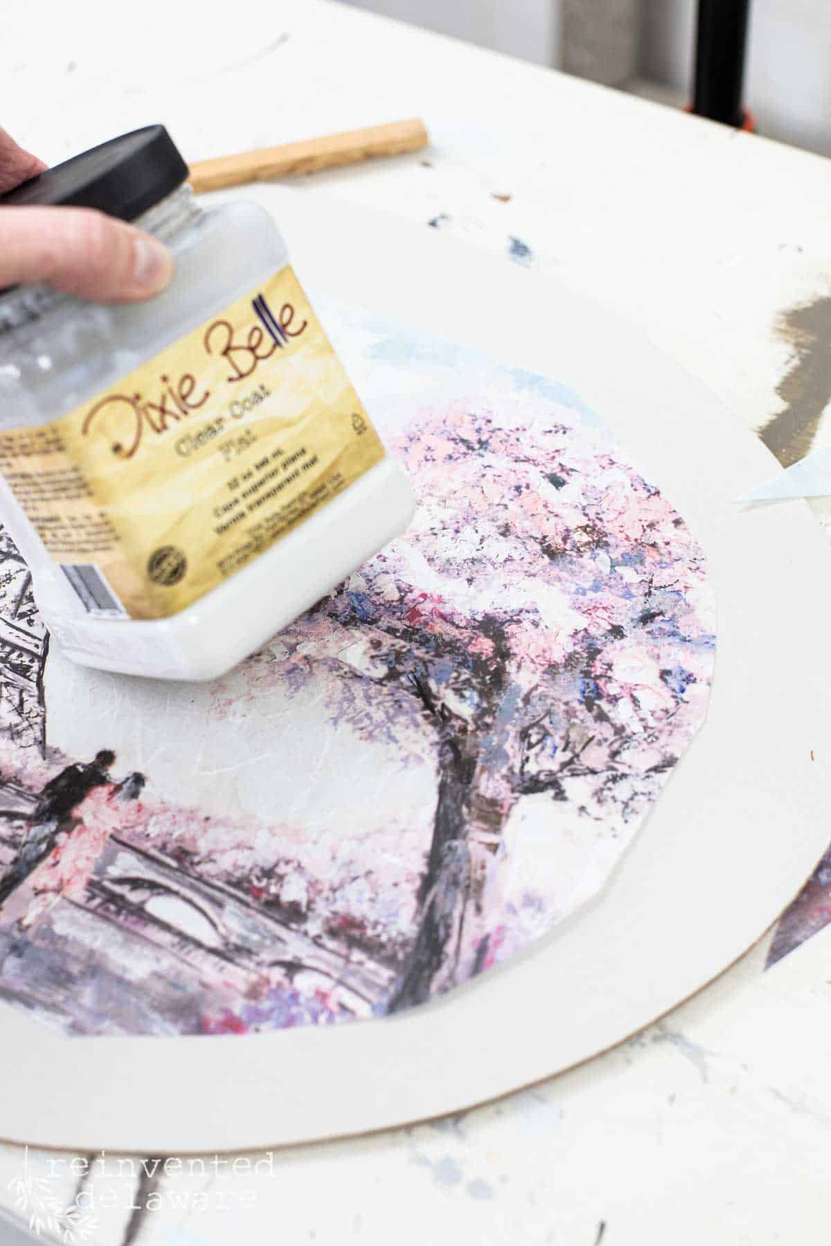 springtime in Paris decoupage paper used to give a thrift store artwork piece a vintage look