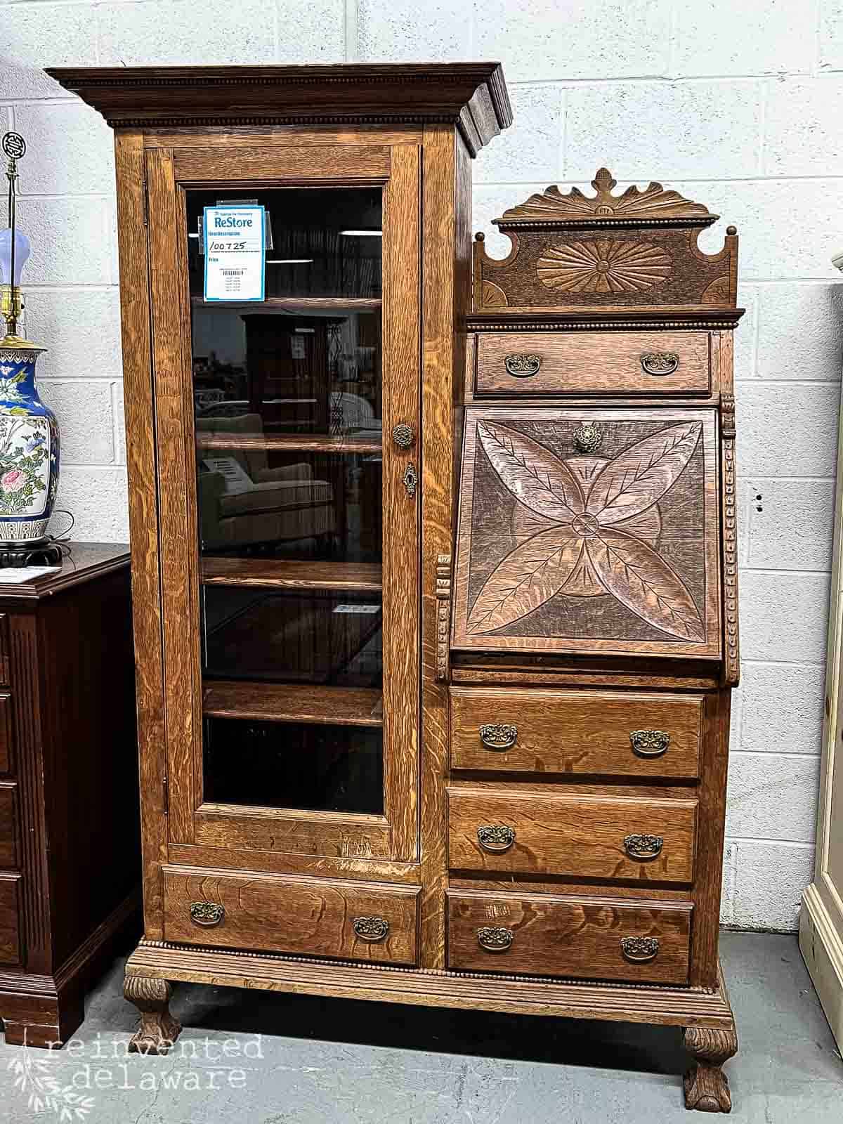 an antique solid oak side by side secretary cabinet in a Restore Habitat for Humanity retail store