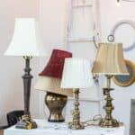 Several outdated thrift store lamps ready for a lamp makeover project.
