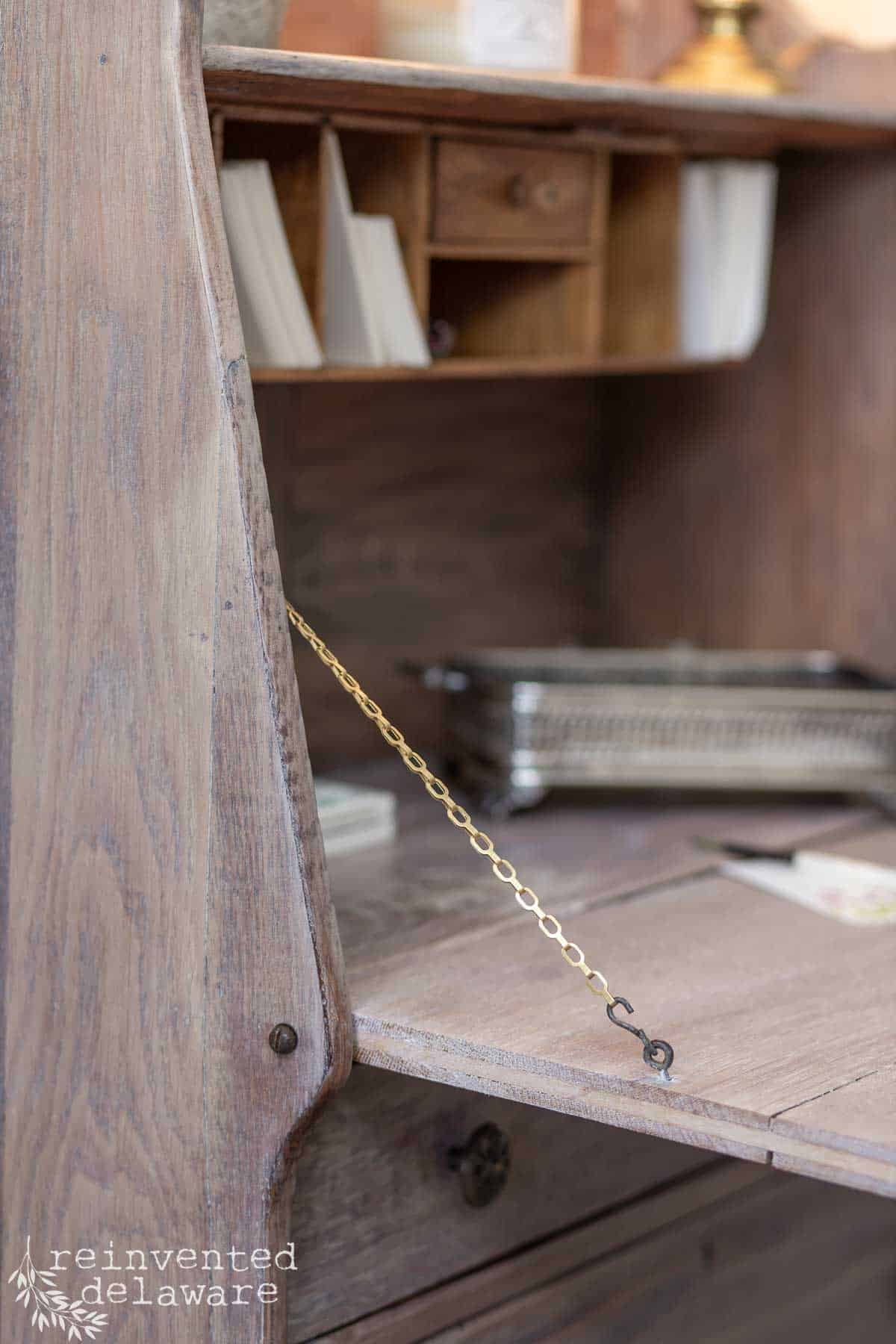 Inside detail of an old secretary desk used in a whitewash furniture before and after tutorial.