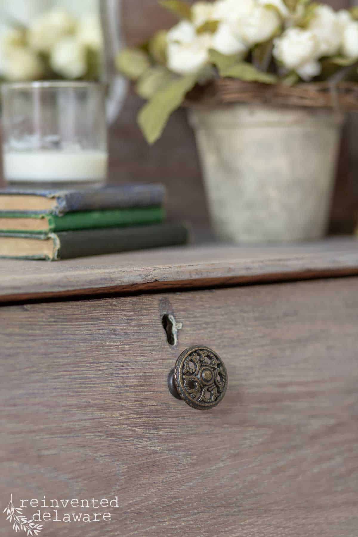 Close up view of vintage inspired drawer pull for a furniture makeover.