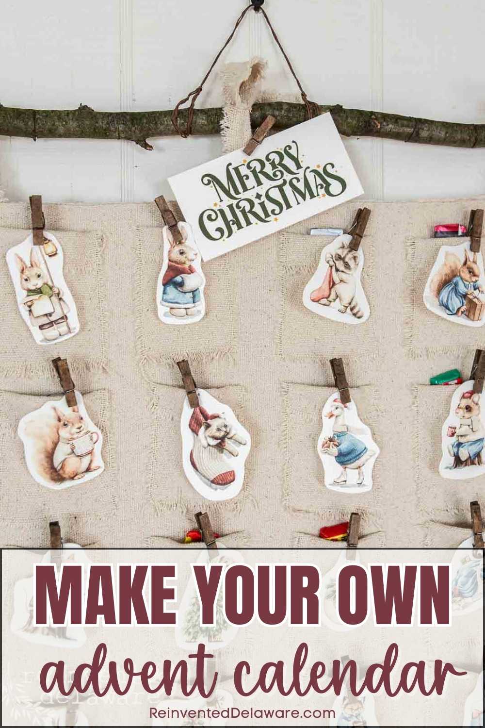 A handmade DIY advent calendar hangs from a branch with clothespins, featuring charming cutouts of animals dressed in holiday attire. A sign above reads "Merry Christmas," and the image includes the text "MAKE YOUR OWN advent calendar.