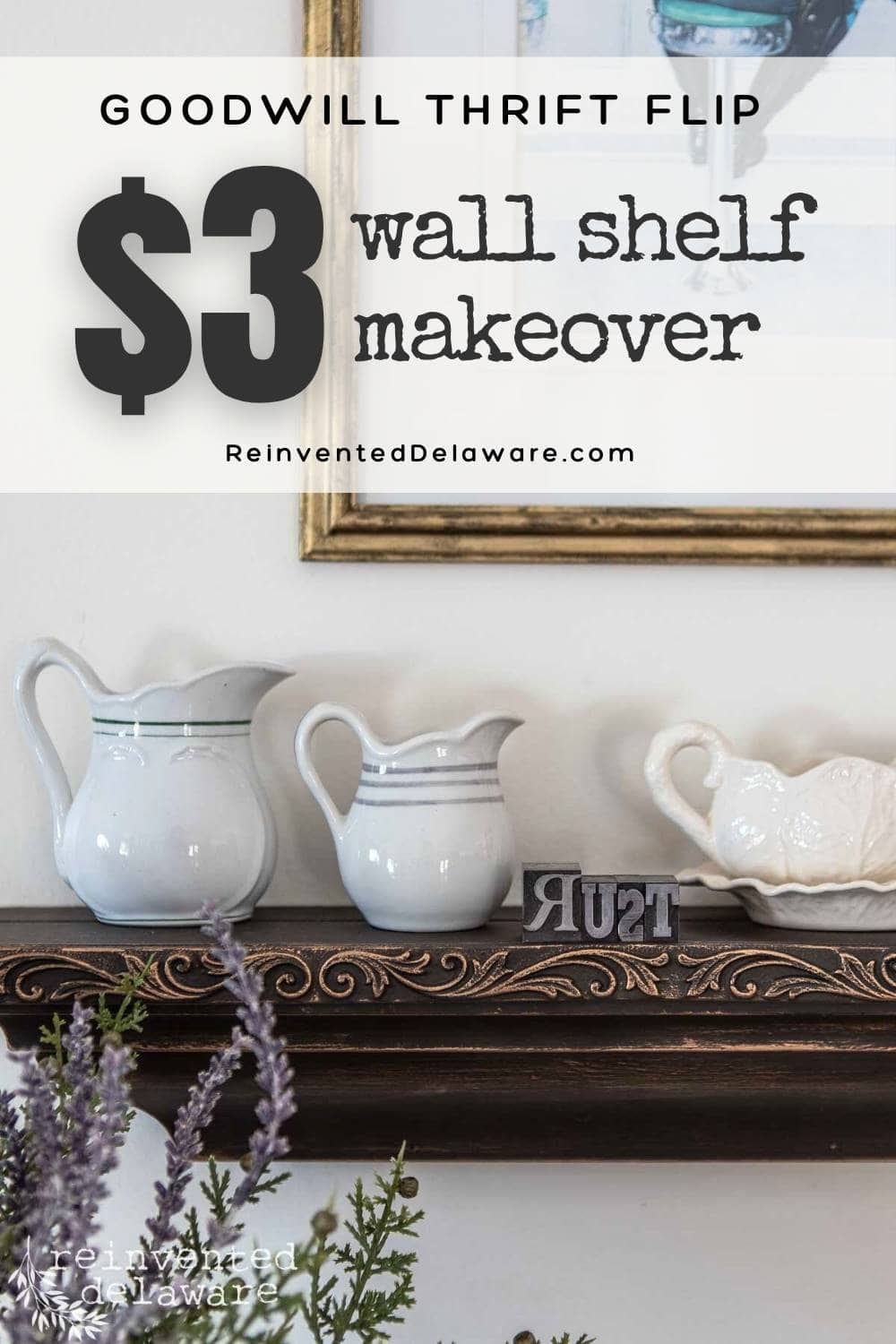 A decorative wall shelf holds two white pitchers and a small white dish. Lavender flowers are in the foreground. Text at the top reads, "Goodwill Thrift Flip $3 Wall Shelf Makeover," with a website link below.