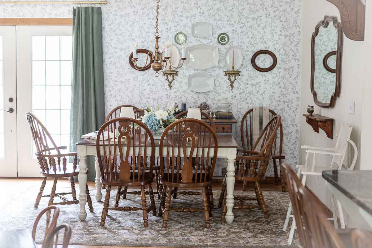 Elegant vintage dining room with wooden chairs and a white table.
