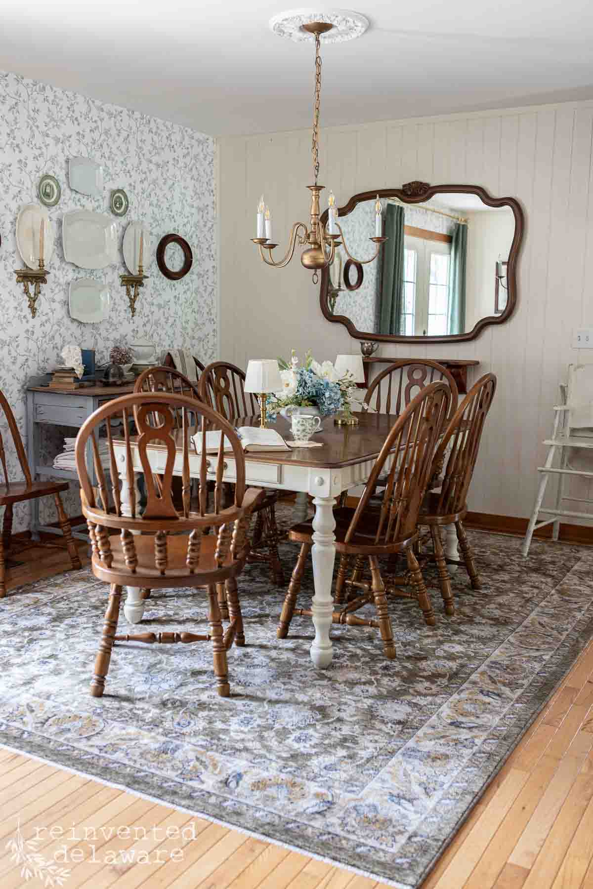 Elegant dining room with vintage decor and wooden furniture.