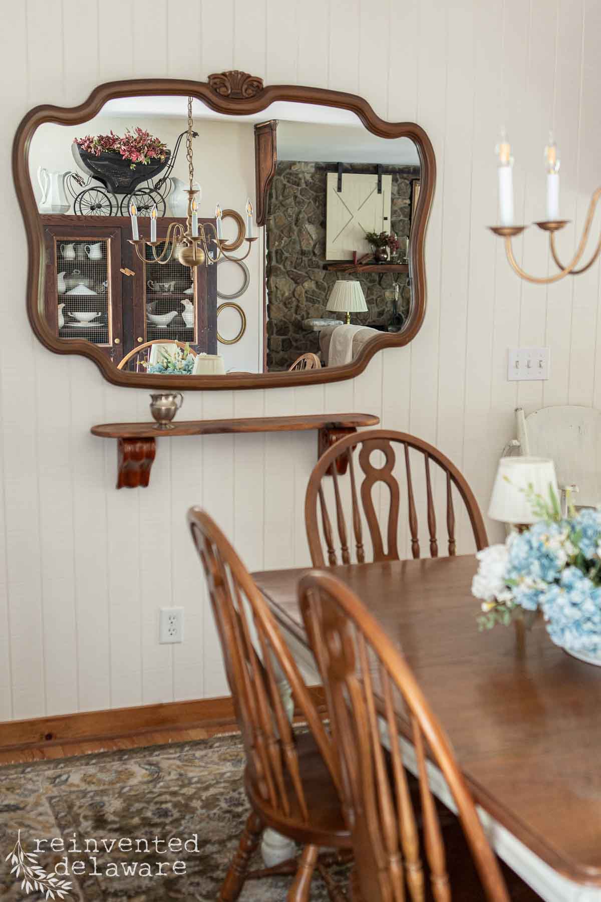 Reinvented Delaware dining room with vintage decor, wooden furniture, and elegant lighting.