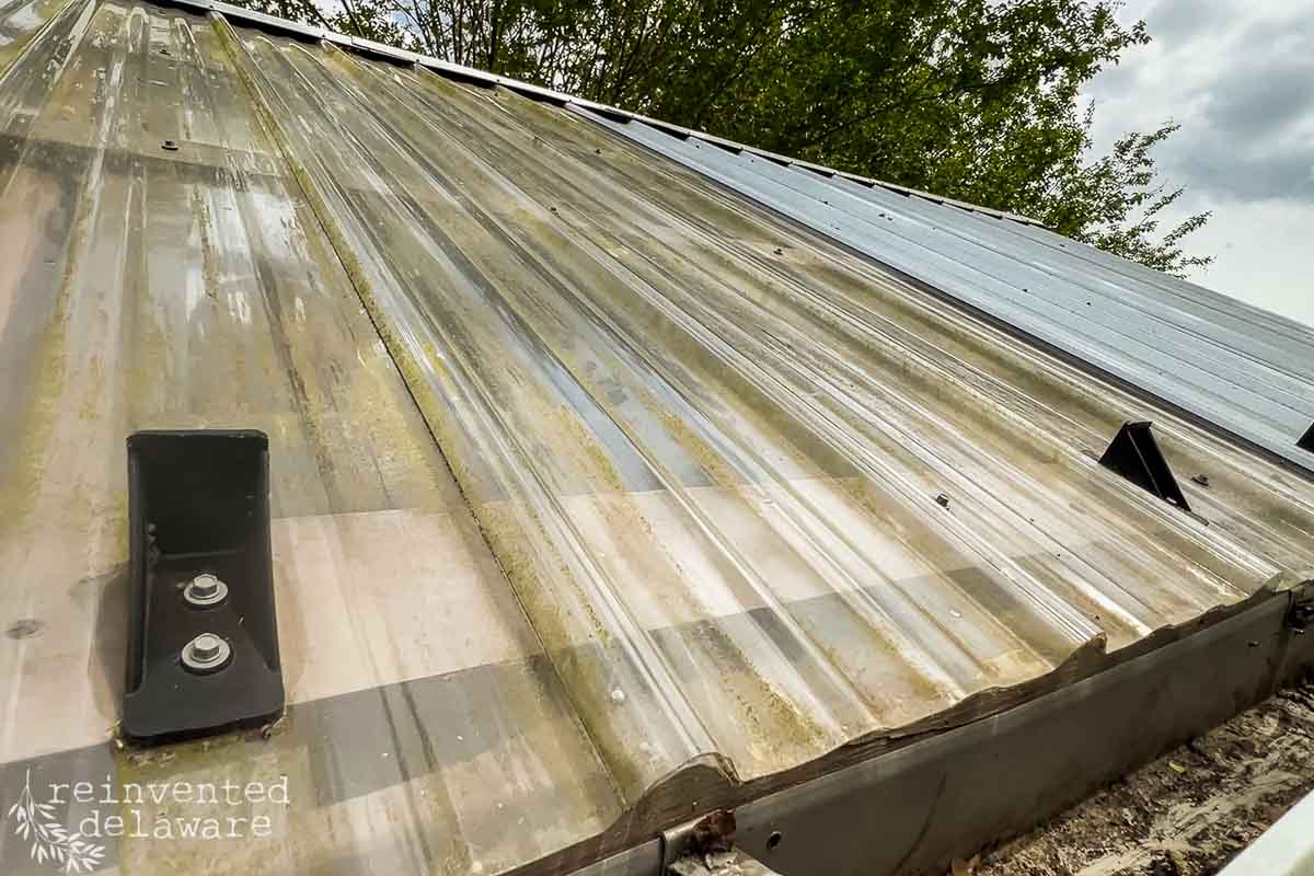 Solar panel installed on a metal roof on garden she shed